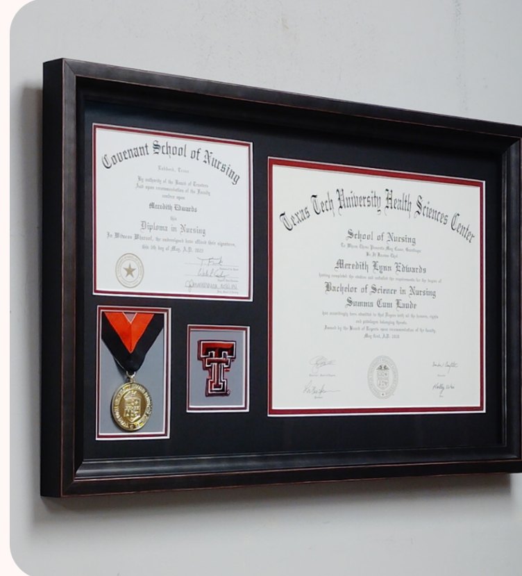 Nursing diplomas, a medal, and a Texas Tech emblem in a black shadow box